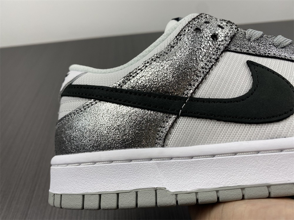 the nike dunk low features silver cracked leather do5882-001