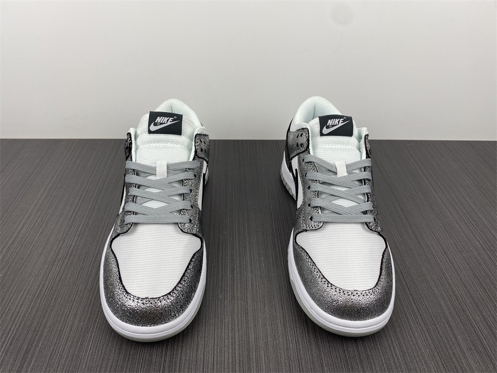 the nike dunk low features silver cracked leather do5882-001