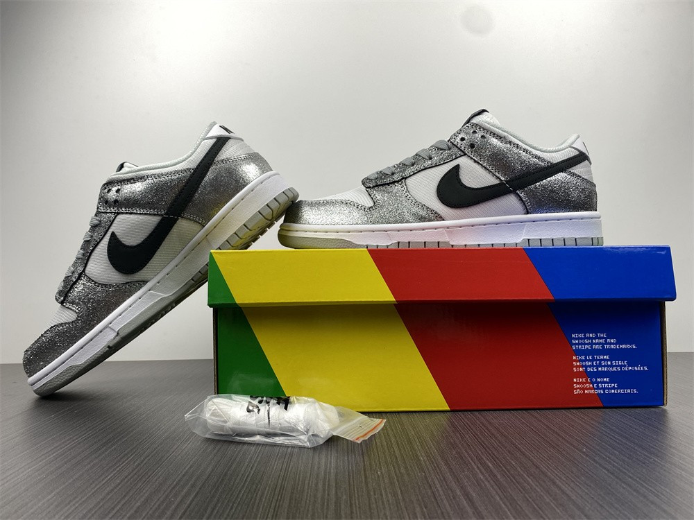 the nike dunk low features silver cracked leather do5882-001