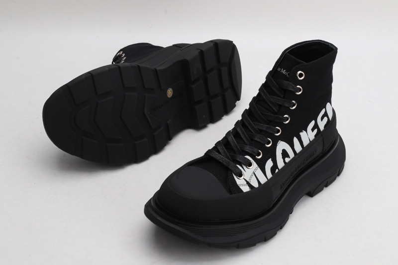 alex mcq tread slick boot in black with letters