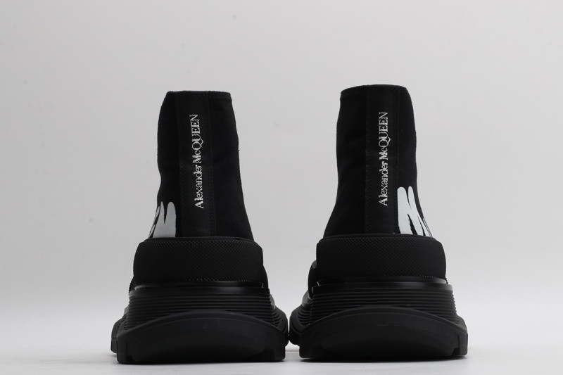 alex mcq tread slick boot in black with letters