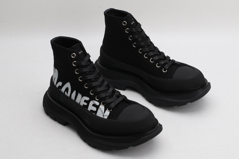 alex mcq tread slick boot in black with letters