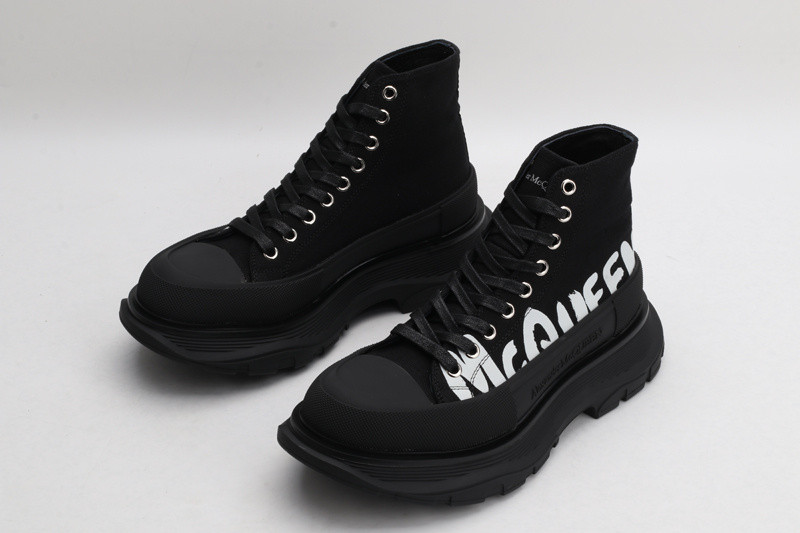 alex mcq tread slick boot in black with letters