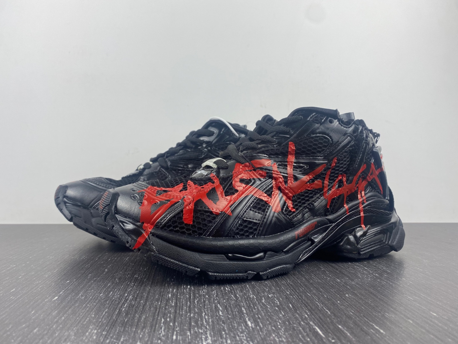 Ba*len*cia*ga men''s runner graffiti sneaker in black